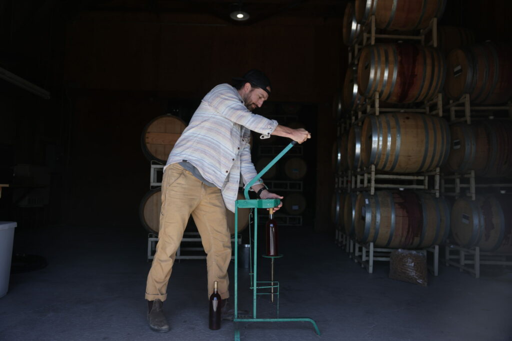 Local wine entrepreneurs take a hands-on approach to all aspects of winemaking — from corking and labeling bottles to printing their personal phone numbers on the label. (Beth Schlanker / for Sonoma Magazine)