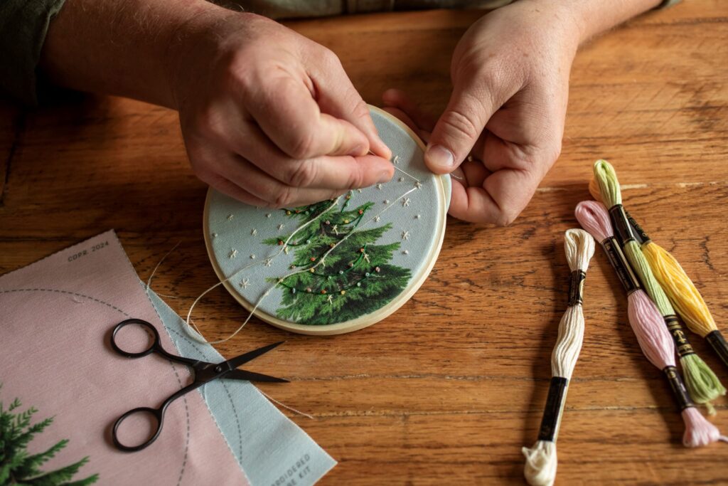 Embroidery artist Robert Mahar stitches together one of his art projects. (Chad Surmick / Sonoma Magazine)