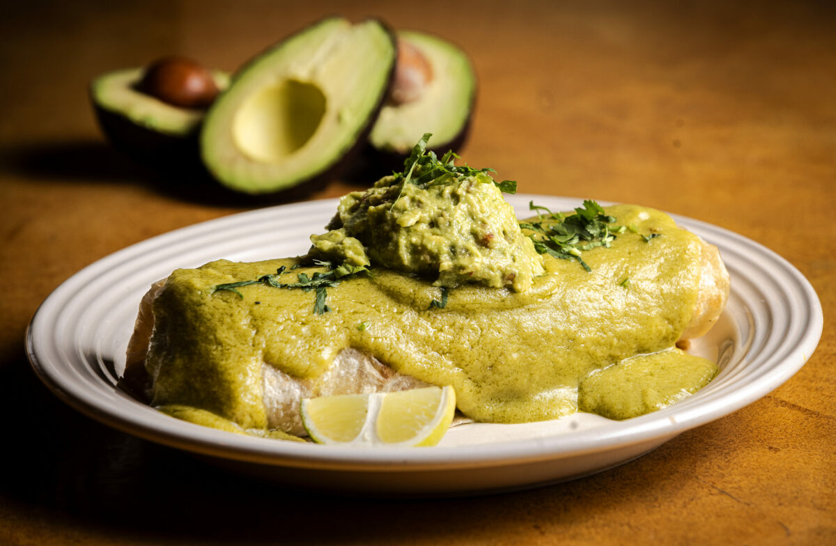 The Gratitude Burrito with refried beans, shredded yam and potato mixed, corn salsa, pico de gallo salsa, guacamole covered in a creamy jalapeño sauce rom Viva Mexicana Wednesday, January 29, 2025 in Sebastopol. (John Burgess / The Press Democrat)