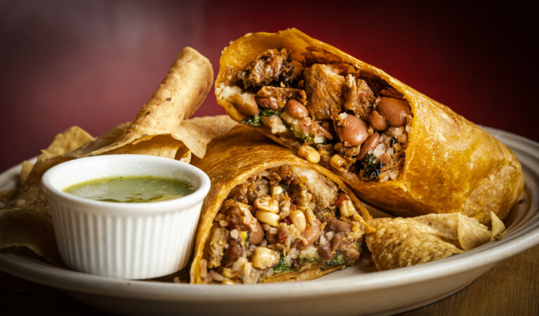 The Isaiah's Go To Burrito with crispy carnitas, pinto beans, Spanish rice, corn salsa, jalapenño salsa and organic mixed greens in a tomato tortilla from Viva Mexicana Wednesday, January 29, 2025 in Sebastopol. (John Burgess / The Press Democrat)