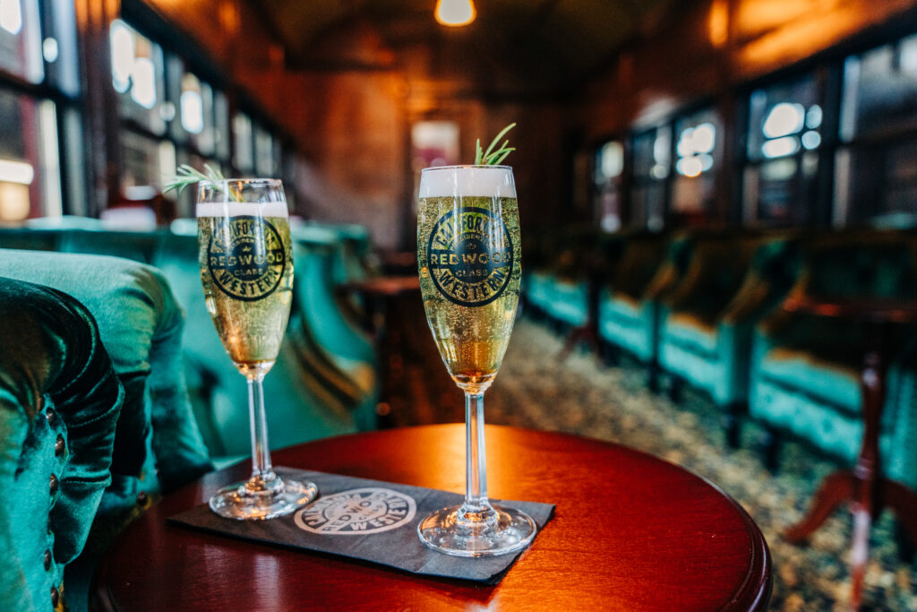 Sparkling wine is served on the Presidential Car on the Skunk Train in Fort Bragg. (Skunk Train)