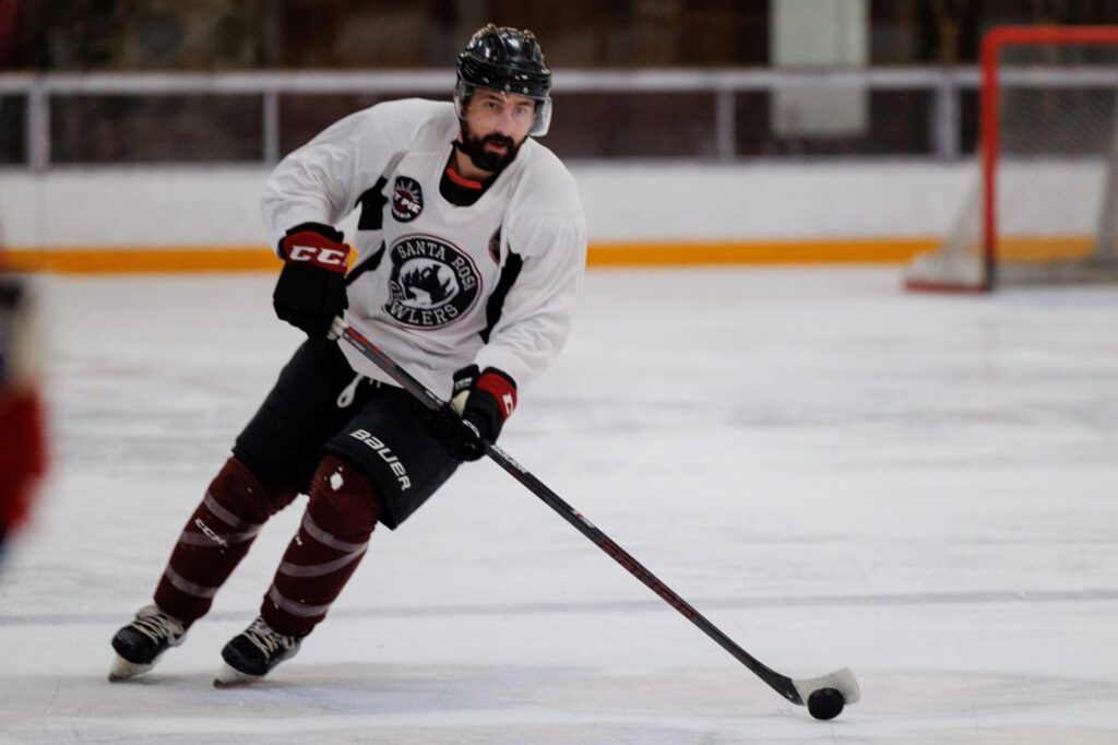 Growler’s John Keshishian skates with the puck during their practice at Snoopy's Home Ice in Santa Rosa on Jan. 2, 2024. (Abraham Fuentes/ For The Press Democrat)