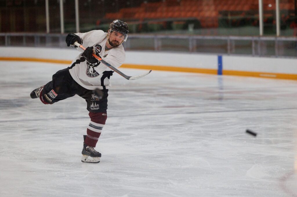 Growler’s Blake Johnson hits the puck towards the net during their practice at Snoopy's Home Ice in Santa Rosa on Jan. 2, 2024. (Abraham Fuentes/ For The Press Democrat)