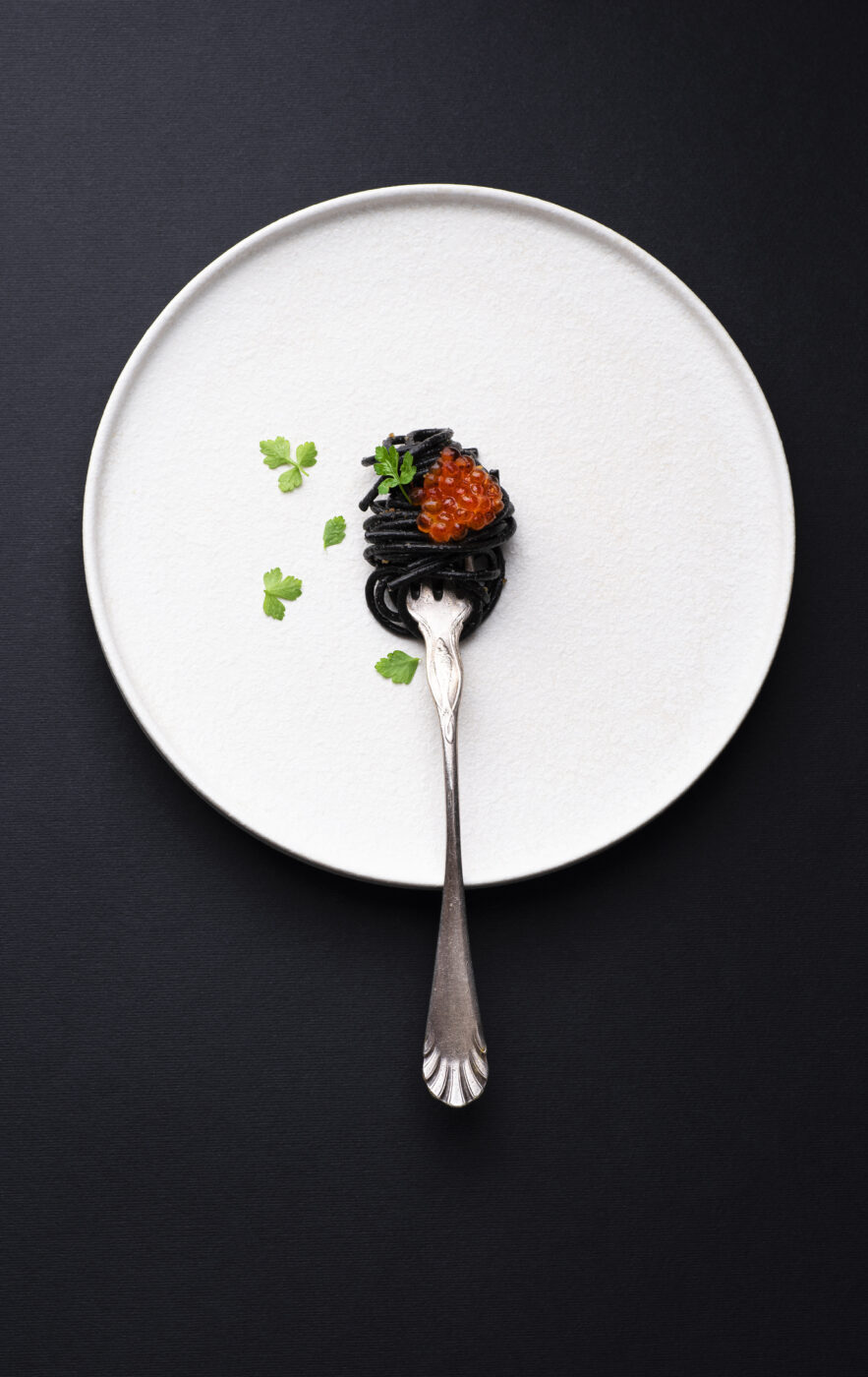 Black pasta with cuttlefish ink and red caviar, served with breadcrumbs fried in olive oil. (UliU / Getty Images)