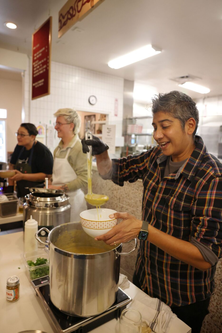 Chef Preeti Mistry serves up a butternut squash dal soup during the Queer Soup Night event at Slow Co. Pizza in Cotati Sunday, Nov. 23, 2025. (Beth Schlanker / The Press Democrat)