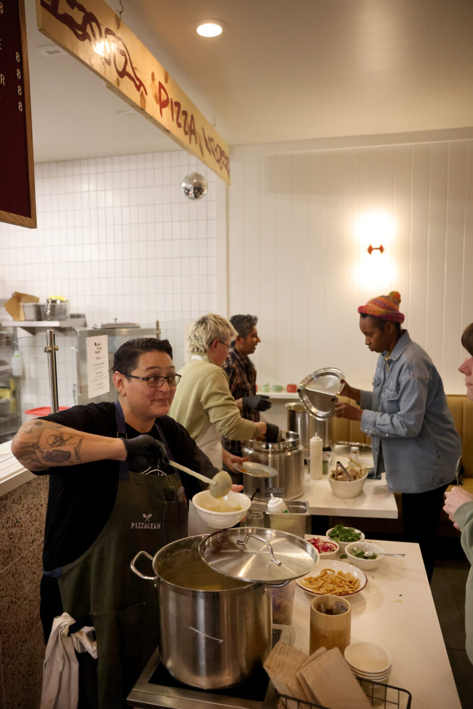 Chef Leah Scurto serves potato leek soup during the Queer Soup Night event at Slow Co. Pizza in Cotati Sunday, Nov. 23, 2025. (Beth Schlanker / The Press Democrat)