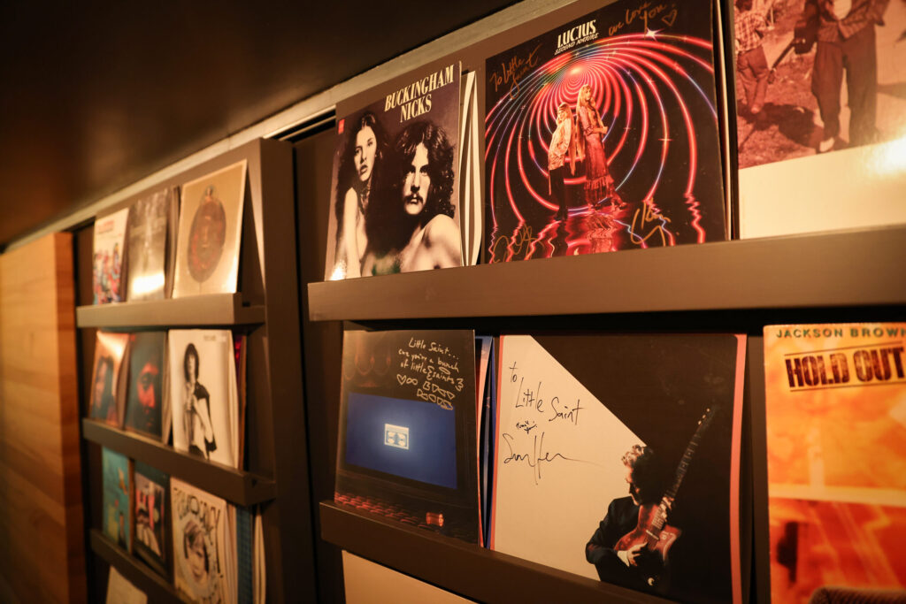 Autographed records by performers adorn a wall at Little Saint in Healdsburg on Thursday, November 13, 2025. (Christopher Chung/The Press Democrat)