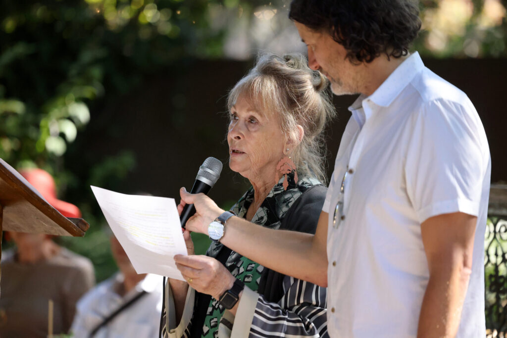 Artist Susan Preston speaks before a crowd during a launch party for her book “In Ghost Time: The Art and Stories of Susan Preston” at Barndiva in Healdsburg Sunday, Sept. 14, 2025. (Beth Schlanker / The Press Democrat)