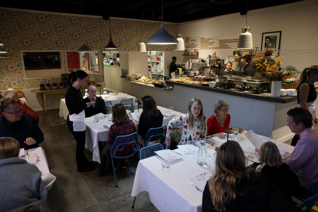 People attend a holiday julbord at Stockhome in Petaluma Sunday, Dec. 14, 2025. (Beth Schlanker / The Press Democrat)