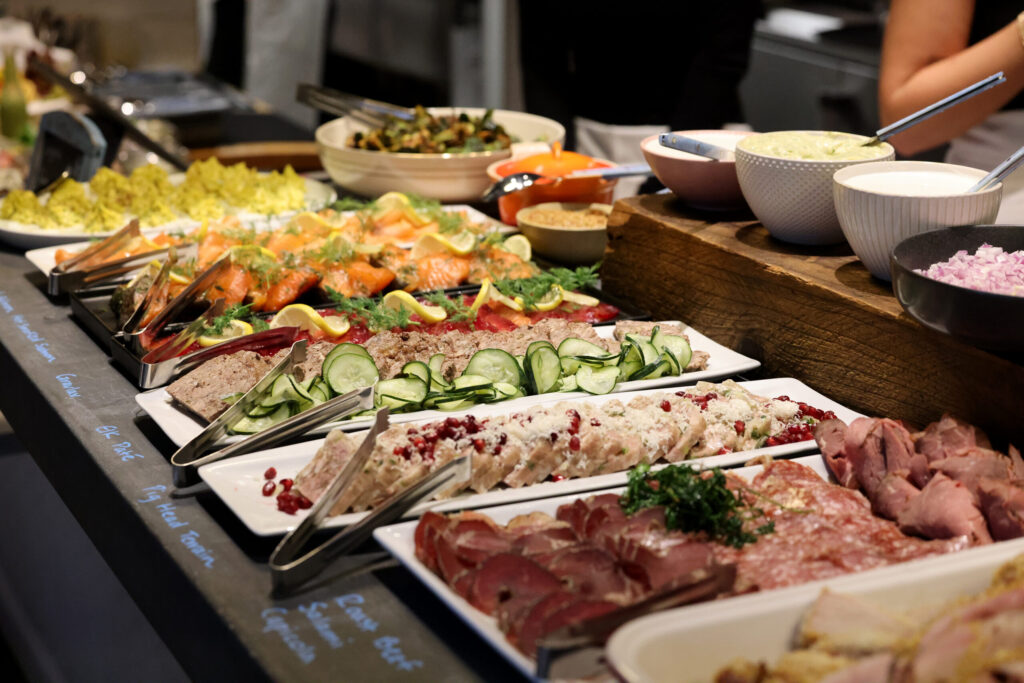 A holiday julbord featuring beet cured gravlax, cold and hot smoked salmon, charcuterie, elk pate, pig head terrine, anddeviled eggs at Stockhome in Petaluma Sunday, Dec. 14, 2025. (Beth Schlanker / The Press Democrat)