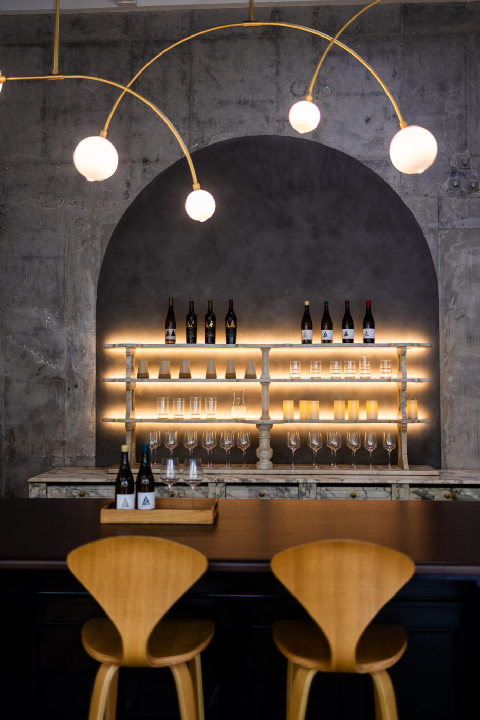 Seating includes a velvet banquette with marble-topped tables and a couple of bar seats at Marietta Cellars tasting room in Healdsburg. (Bryan Meltz)
