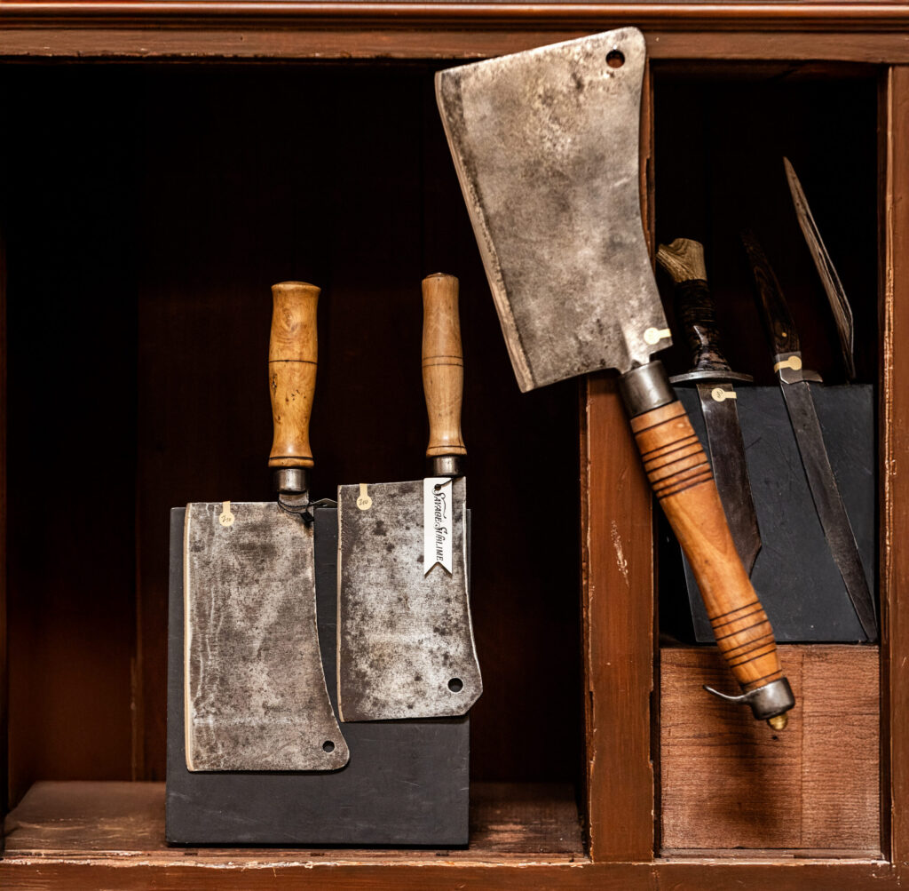 Knives and cleavers fashioned from antique metal from Savage Sublime, one of the many vendors inside the Antique Society Thursday, Oct. 2, 2025 in Sebastopol. (John Burgess / The Press Democrat)