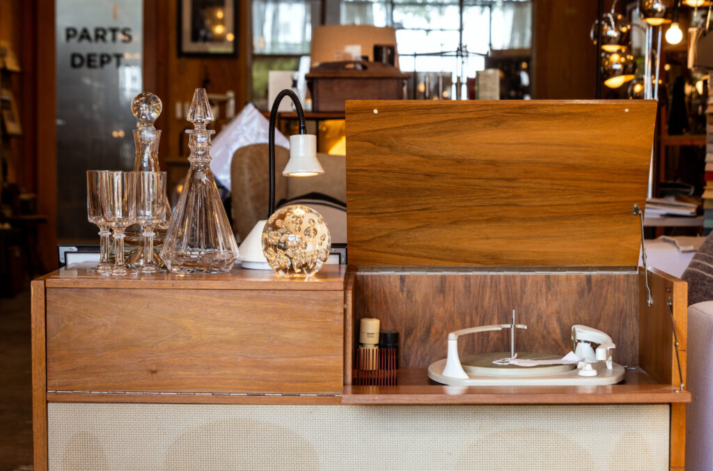 Antique glassware and console stereo at Hero California Friday, Feb. 27, 2025 in Sebastopol. (John Burgess / The Press Democrat)