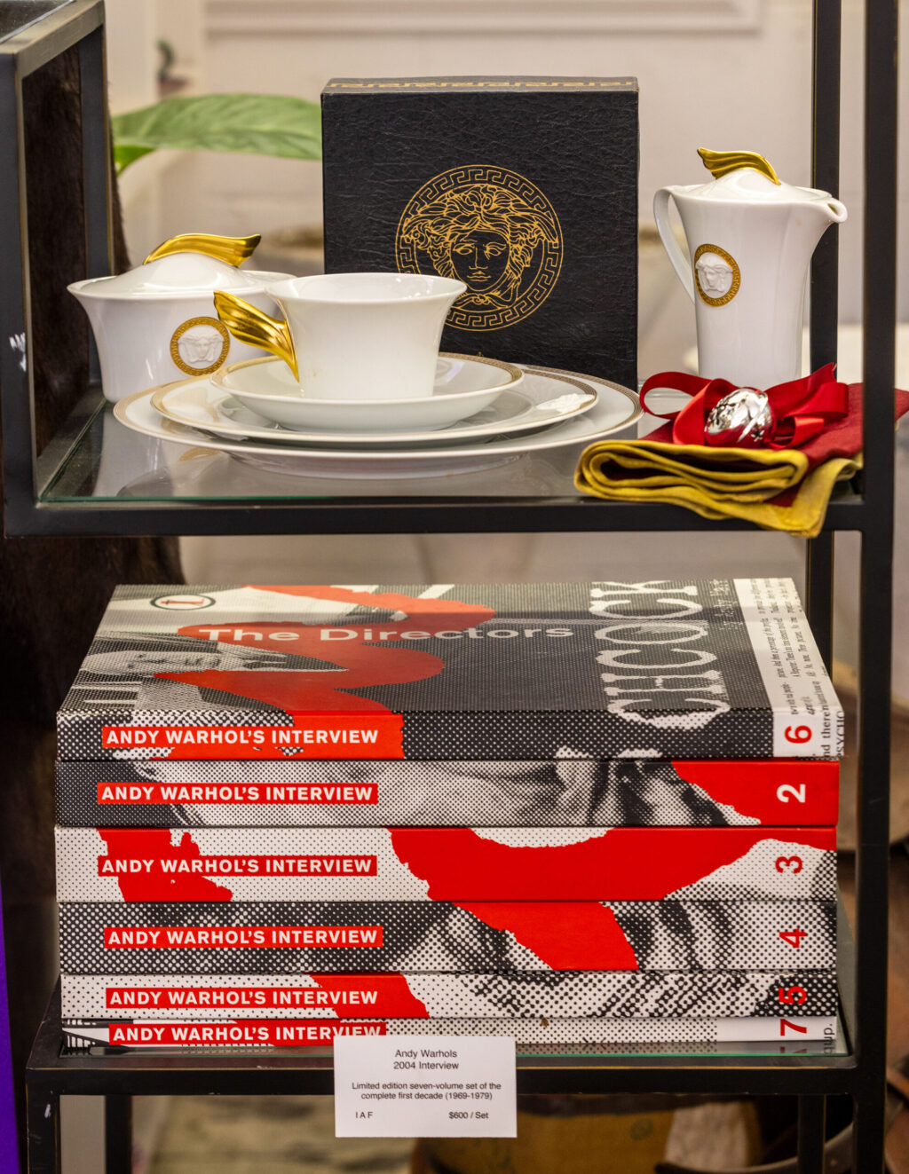 Versace China and a collection of Andy Warhol books from Lady Buck Vintage Wednesday, Oct. 6, 2025, in Agua Caliente. (John Burgess / The Press Democrat)