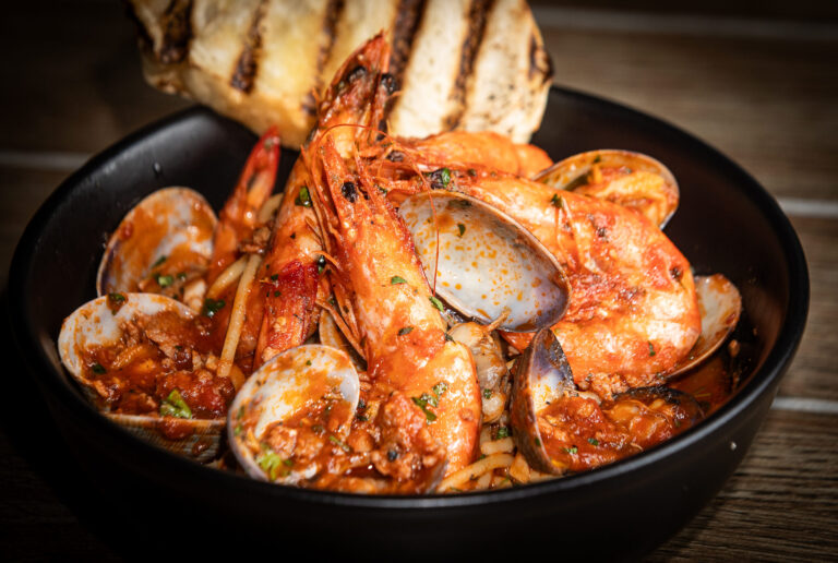 Clam, Prawn & Sausage Sauté served with grilled sourdough from Catelli’s Restaurant Sunday, Dec. 21, 2025 in Geyserville. (John Burgess / The Press Democrat)