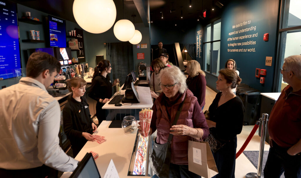 The lobby of True West Film Center is packed during its grand opening, Saturday, Oct. 25, 2025, in Healdsburg. (Kent Porter / The Press Democrat)
