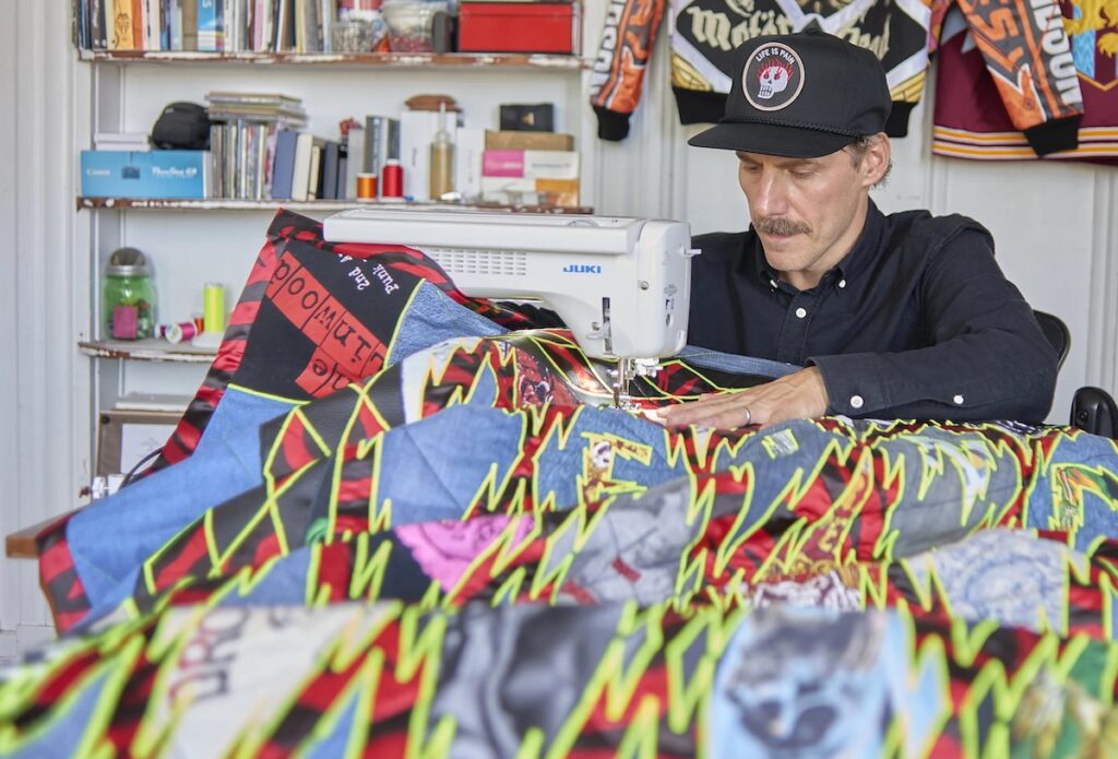Ben Venom sews the stunning curtain that hangs behind the stage at Little Saint in Healdsburg. (Clinton Perry Photography)