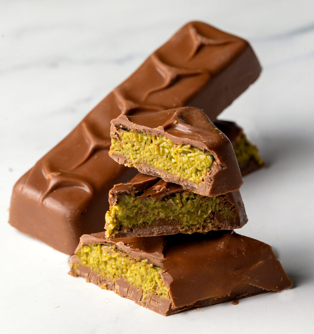 Bert Smith, owner of Bert’s Desserts in Petaluma, jumped on the Dubai Chocolate bandwagon for Mother’s Day, making her own candy bar sized Dubai Chocolate bars mixing Kataifi and Ptstacho Cream for the crunchy filling in the chocolate molds Friday, May 8, 2025 in Petaluma. (John Burgess / The Press Democrat)