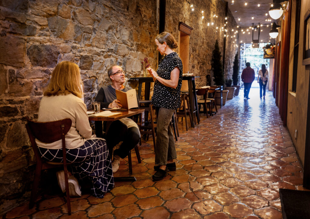 Marjorie Pier takes care of service and chooses the wine pairings at Street Social Thursday, August 14, 2025 Petaluma. (John Burgess / The Press Democrat)