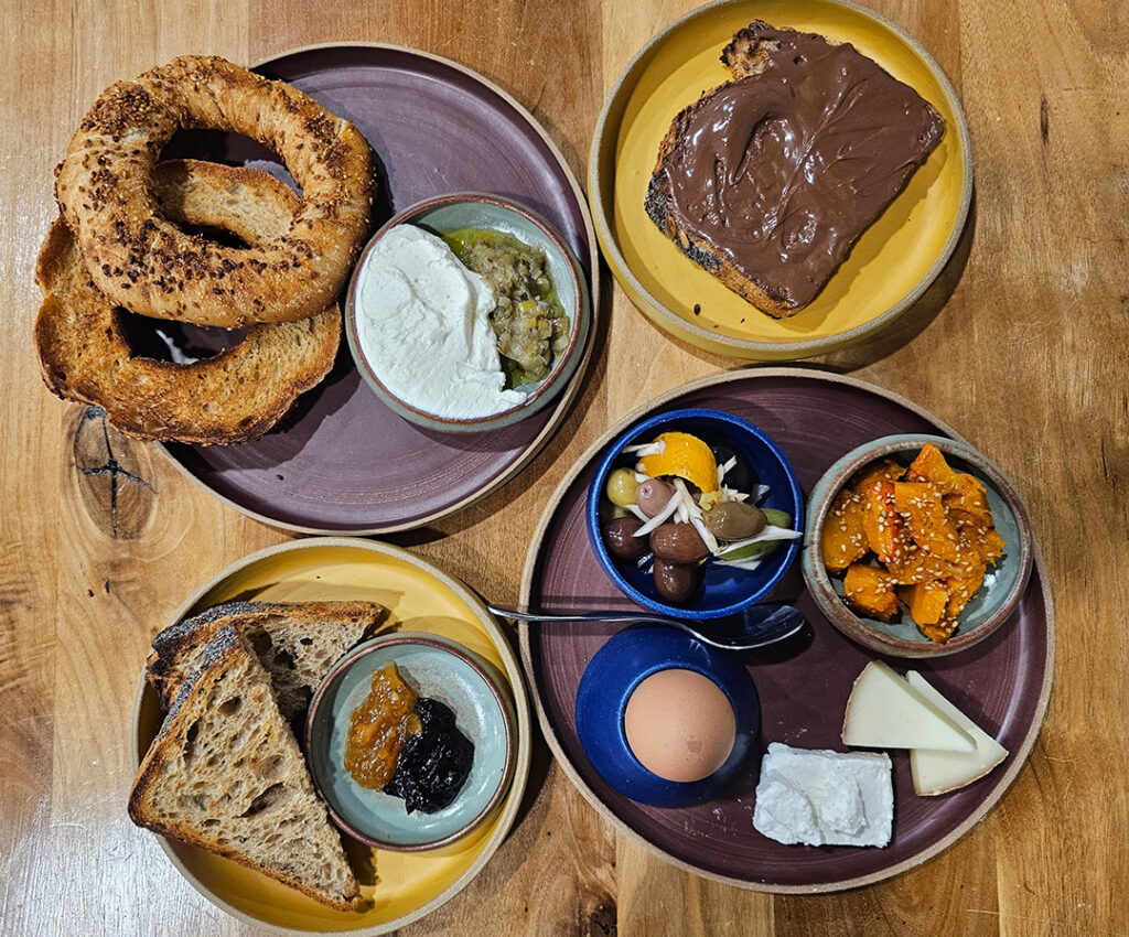 New breakfast items at Quail & Condor in Healdsburg include simit, a cousin to the bagel; toast with chocolate hazelnut spread; Turkish breakfast with a soft boiled egg, cheese, olives and vegetables; and toast with homemade jam. (Heather Irwin / The Press Democrat)