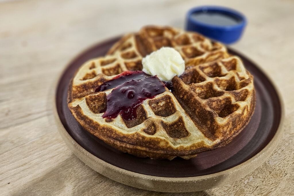 Sourdough waffle with lingonberry jam and butter at Quail & Condor bakery in Healdsburg. (Heather Irwin / The Press Democrat)