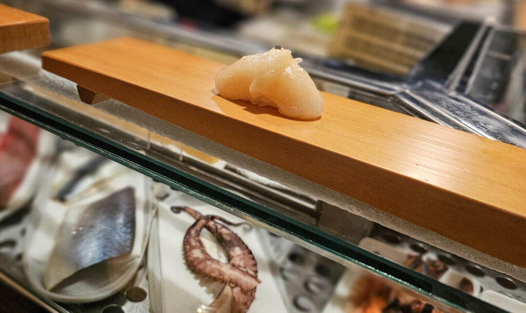Hokkaido scallop nigiri at Sushi Kosho's nine-piece nigiri tasting. (Heather Irwin / The Press Democrat)