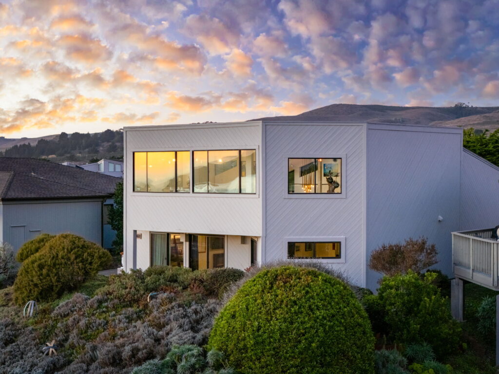 Home exterior at sunset. (Brian Roberts / Loud and Clear Commercial Media)
