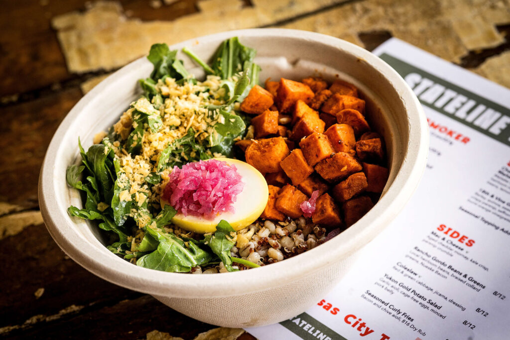 For the vegetarian in the group, the 18th & Vine Grain Bowl with barley, quinoa, sweet potatoes, arugula saffron egg and pickled onion from Stateline Road Smokehouse Friday, August 23, 2024 in Napa. (John Burgess / The Press Democrat)