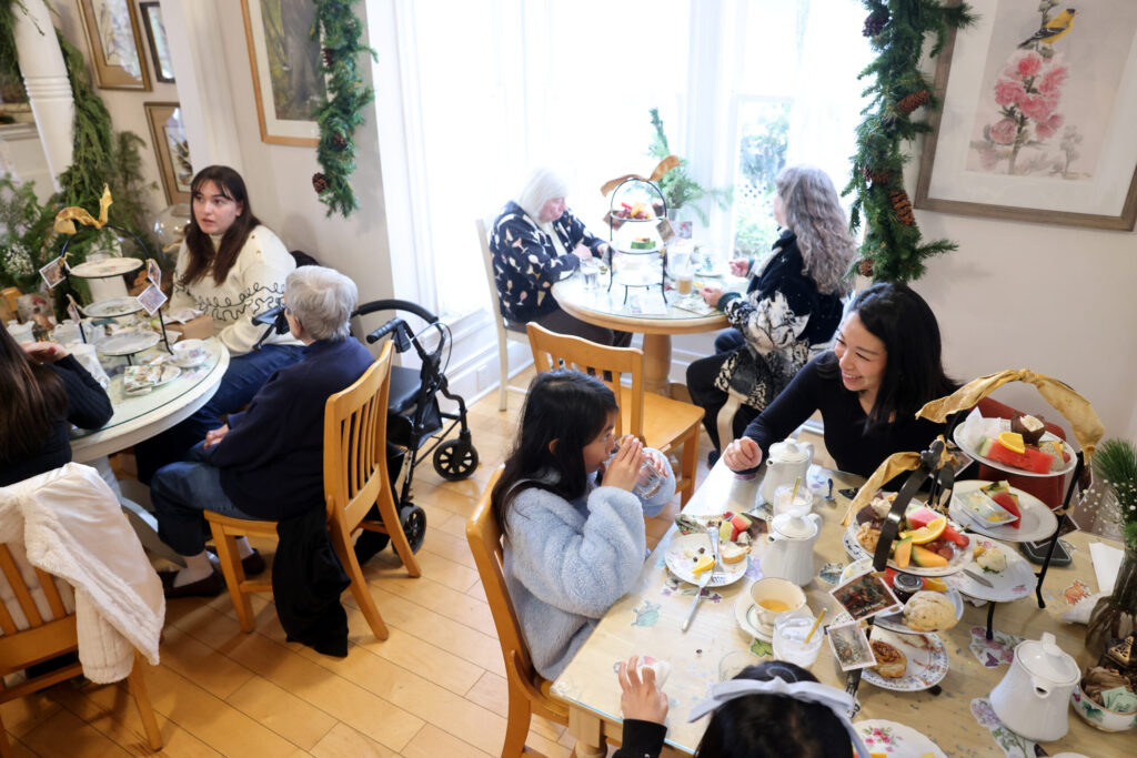 Melissa Perseveranda, right, has tea with her daughters Emmaline, 9, center, and Elanya, 7, bottom, at Muir's Tea Room in Sebastopol Tuesday, Dec. 30, 2025. (Beth Schlanker / The Press Democrat)