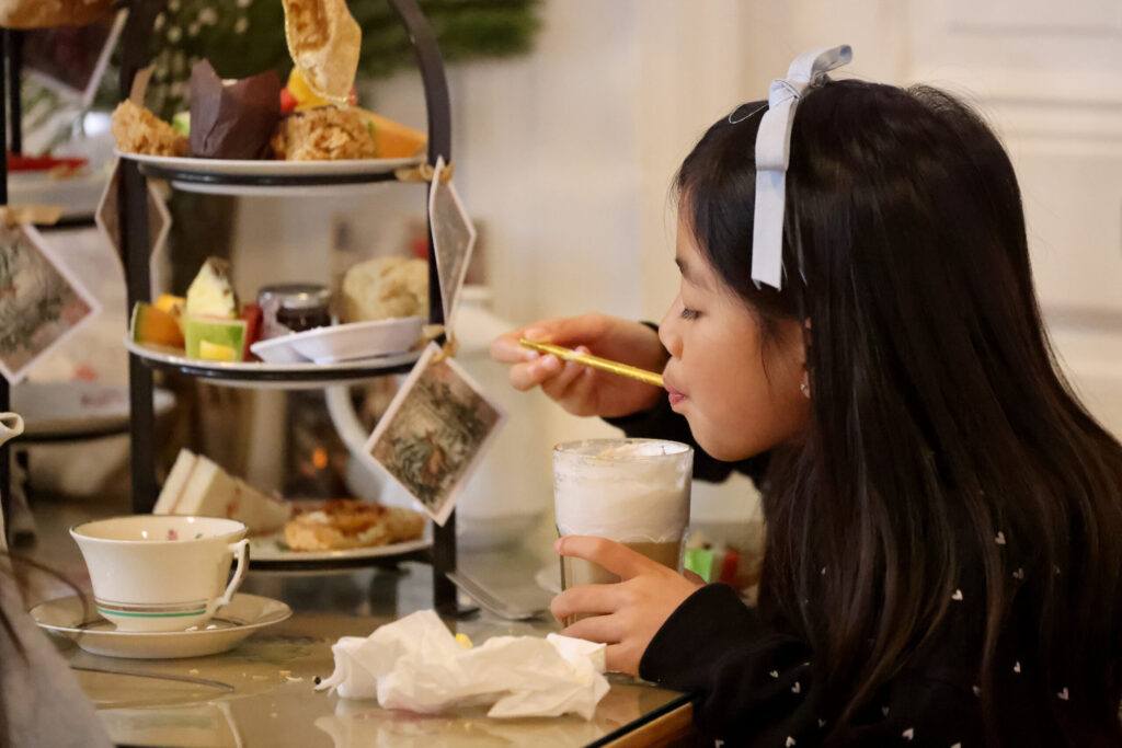 Elanya Perseveranda, 8, attends high tea with her family at Muir’s Tea Room in Sebastopol Tuesday, Dec. 30, 2025. (Beth Schlanker / The Press Democrat)