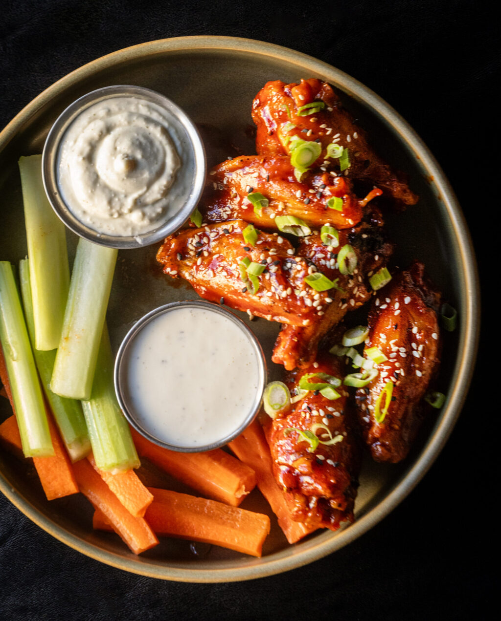Half-Dozen Wings with Buffalo, barbecue, or sweet Korean chili sauce, blue cheese or ranch, celery and carrots from the Healdsburg Bar & Grill Thursday, Jan. 22, 2026 in downtown Healdsburg. (John Burgess / The Press Democrat)