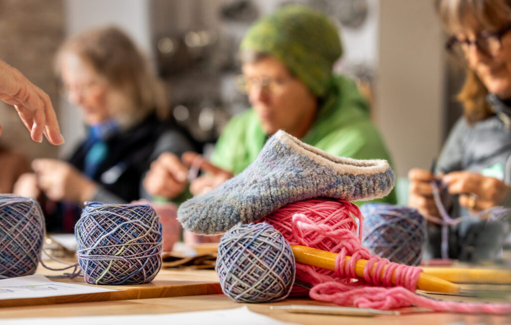 Students learn to make a pair of felted slippers during a class Tuesday Dec. 2, 2025 at Gather in Sebastopol. (John Burgess / The Press Democrat)