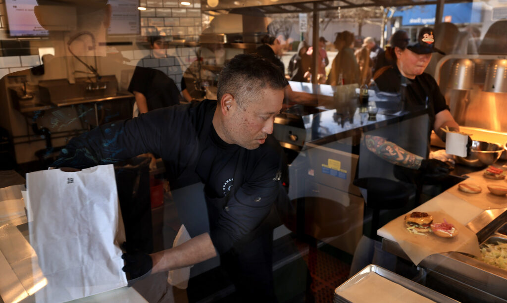 Orders are filled at Pick’s Roadside in Cloverdale, Saturday, Jan. 10, 2026. (Kent Porter / The Press Democrat)