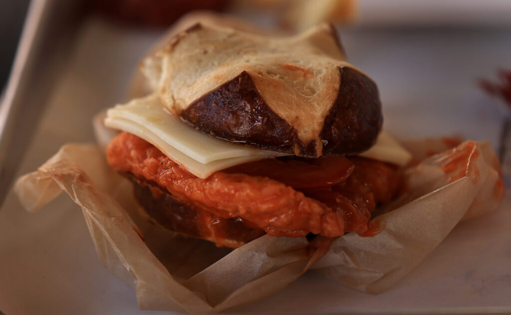 A spicy chicken sandwich on a pretzel bun, Saturday, Jan. 10, 2026, at Picks’s Roadside in Cloverdale. (Kent Porter / The Press Democrat)