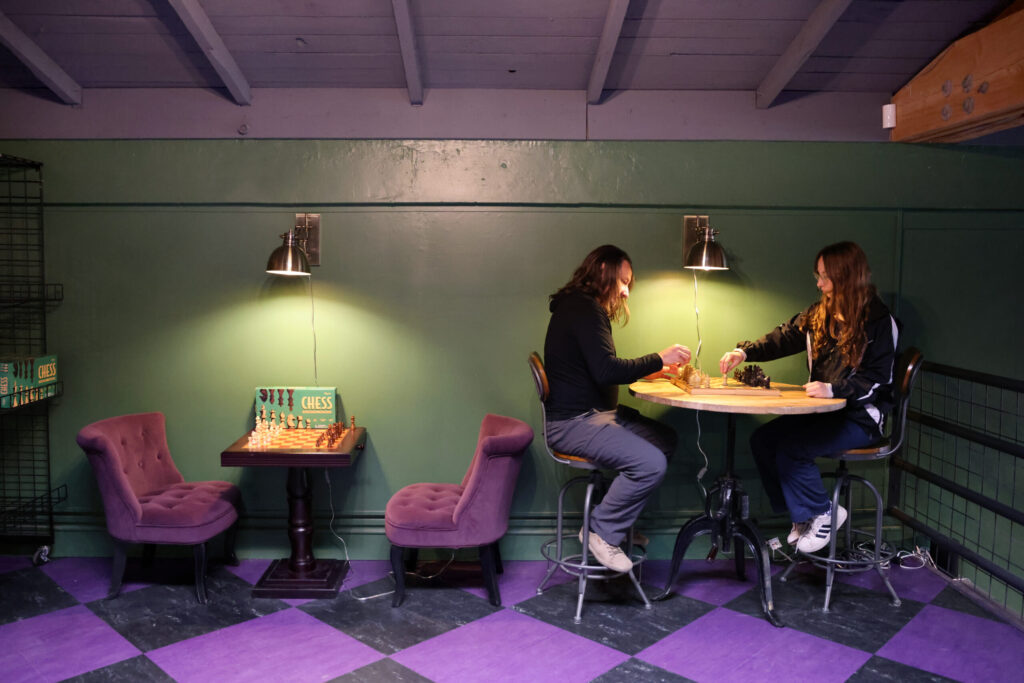 Matt Vallotton and his daughter Celia, 16, play a game of chess at the newly opened Goblin Bros. Games & Gear in Santa Rosa, Sunday, April 14, 2024. (Beth Schlanker / The Press Democrat)