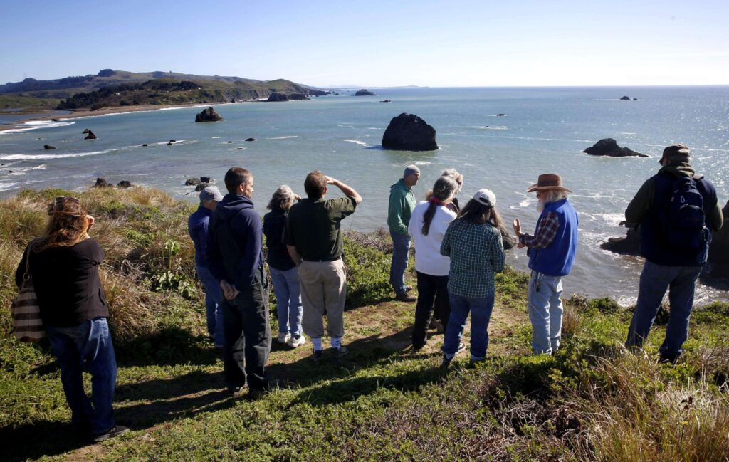 Experienced volunteers lead new volunteers on a Harbor Seal monitoring orientation with Stewards of the Coast and Redwoods in Jenner on Tuesday, Feb. 24, 2015. Stewards of the Coast and Redwoods is looking for volunteer whale watchers. (Beth Schlanker / The Press Democrat, file)