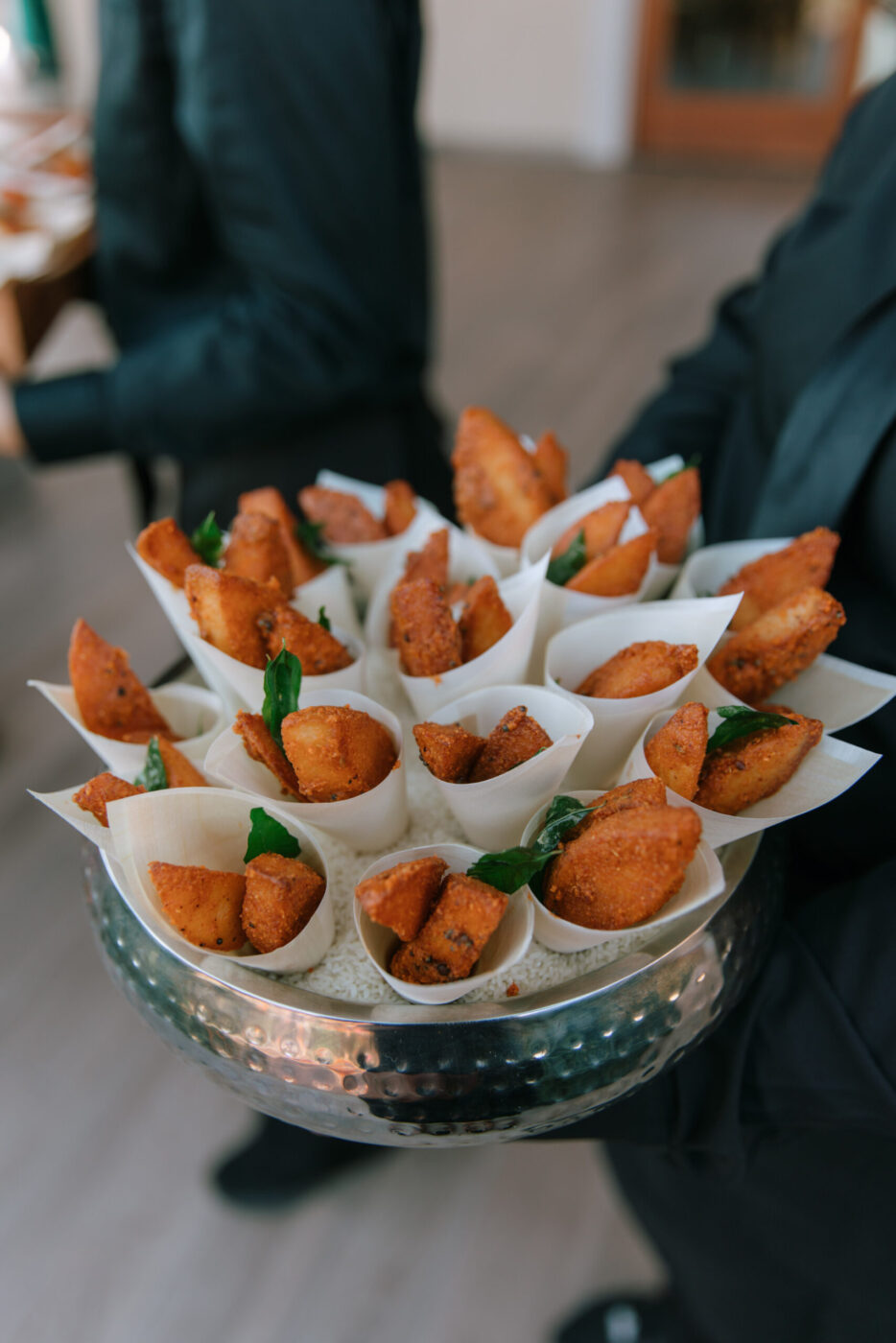 While the wine flowed, guests at Sanjana and Evan's wedding enjoyed food and drink such as samosas and mango lassis. (Katie Miller)