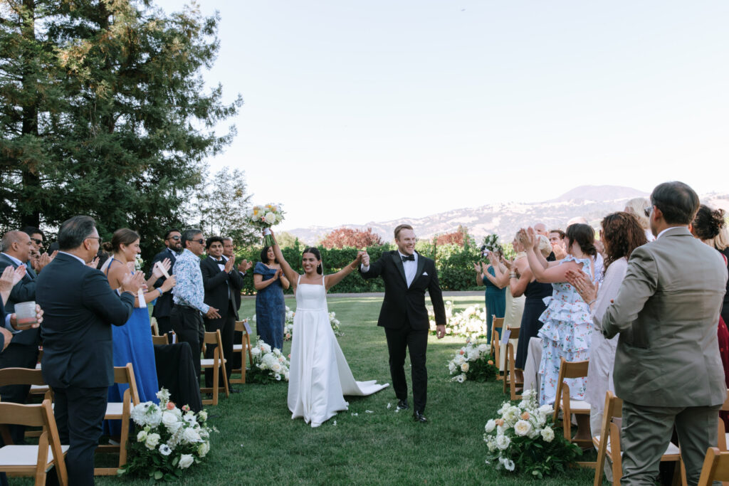 The couple celebrates after exchanging vows at Trentadue Winery. (Katie Miller)
