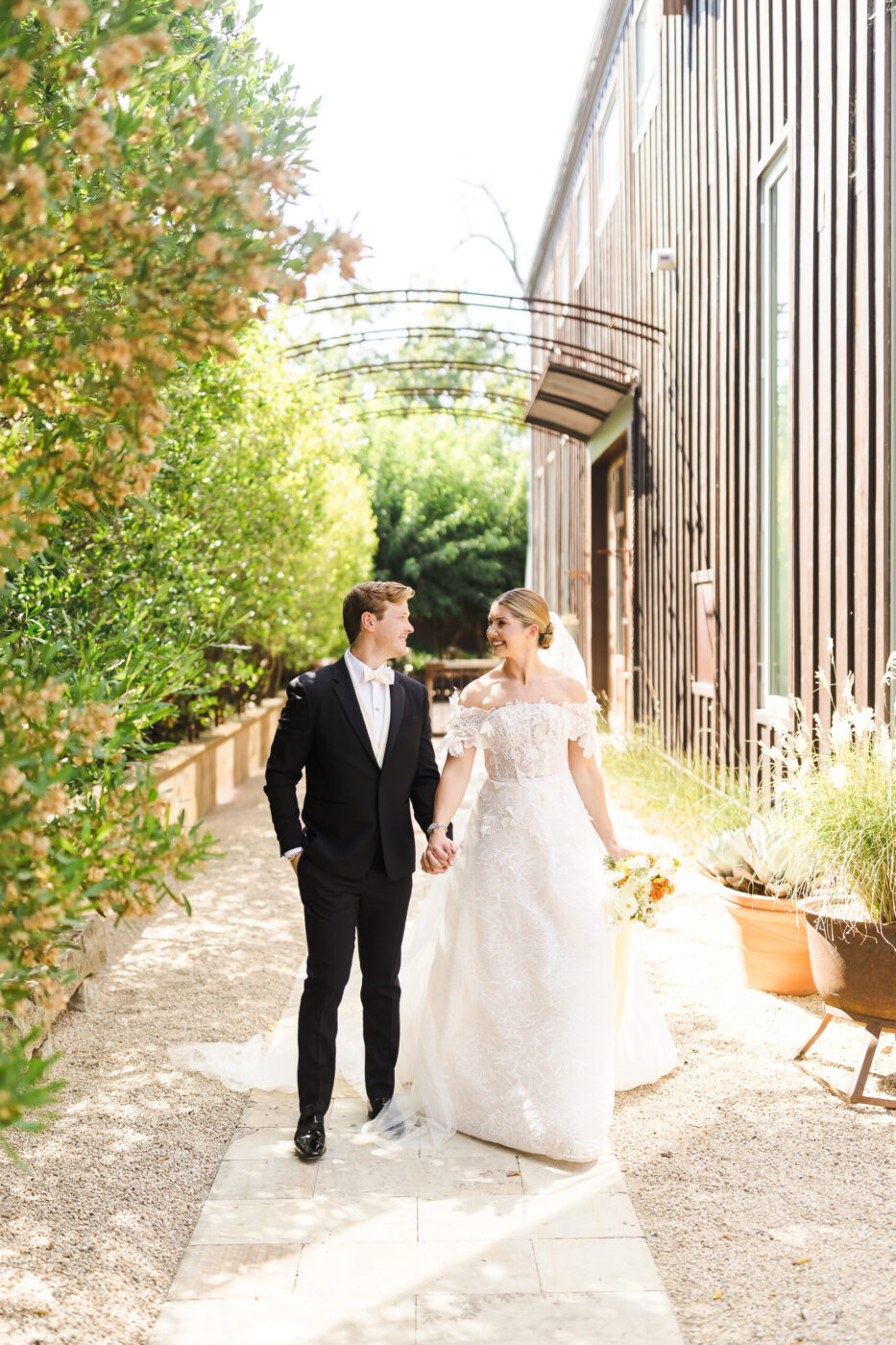 Newlyweds Olivia Fleming and Brooks Schaffer make their entrance at Barndiva in Healdsburg. Unbeknownst to most guests, the couple were married two days earlier in a private church ceremony. (Katie Monroe)