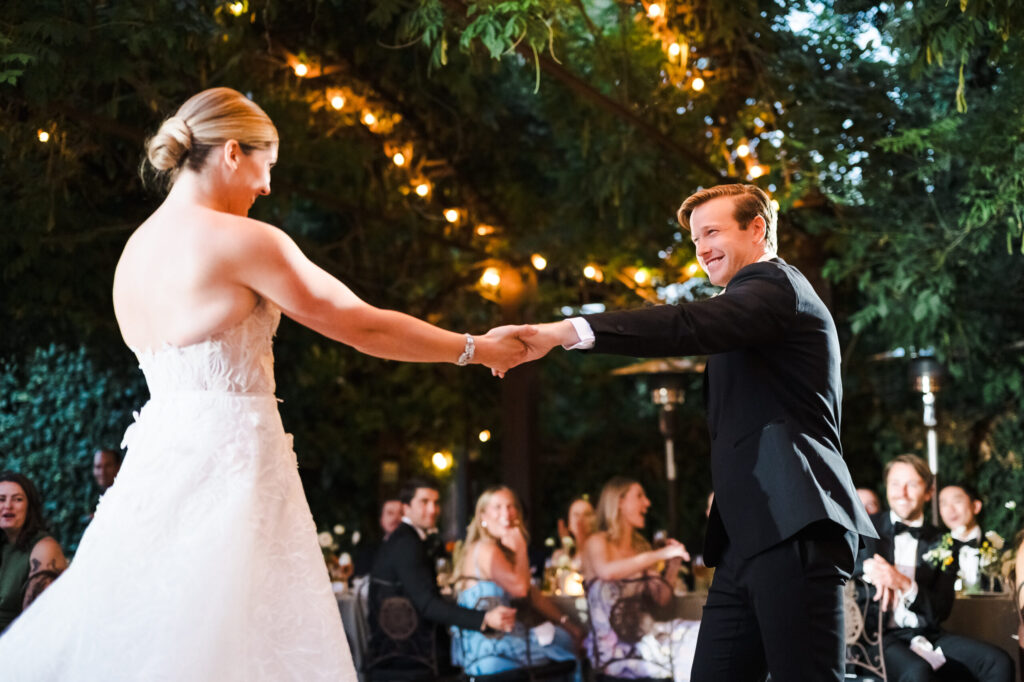 The couple perform a choreographed first dance. (Katie Monroe)