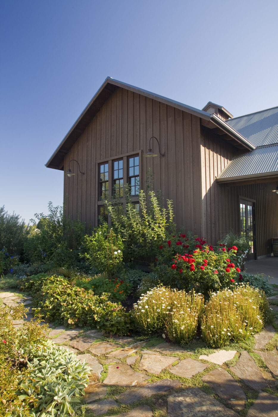 At Dutcher Crossing Winery in Geyserville, vineyard-facing tables sit in a covered breezeway, beneath a pergola, on a paved patio and alongside a pétanque court. Wine Country doesn’t get much prettier than this. (M. J. Wickham)