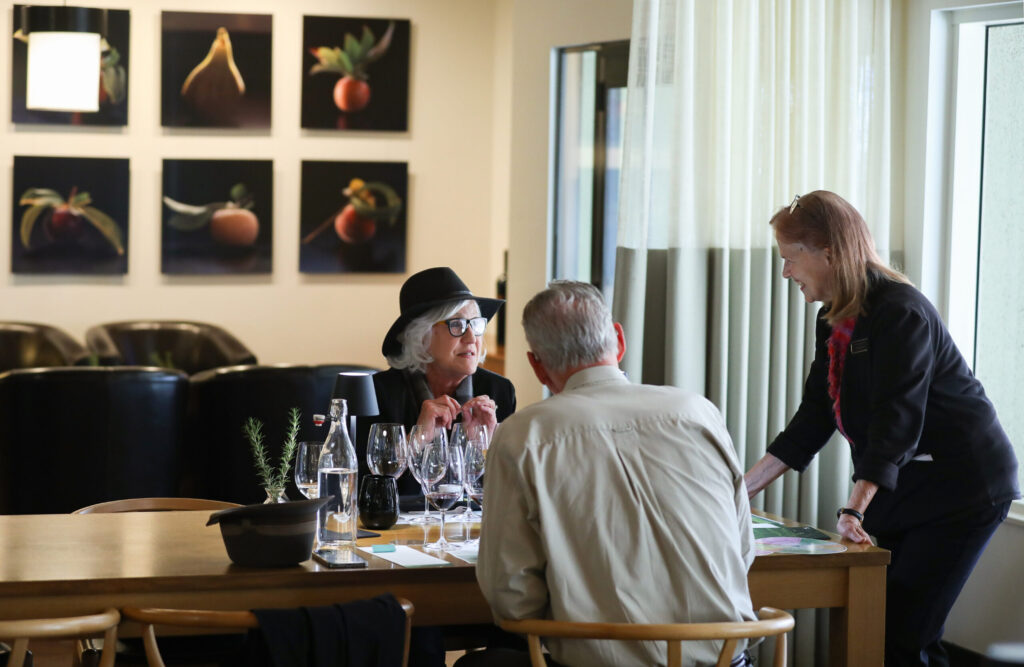 Wine educator Suzanne Ricard talks to winery guests David and Peggy Templeton at St. Supéry Estate Vineyards & Winery in Rutherford on Friday, January 30, 2026. (Christopher Chung/The Press Democrat)