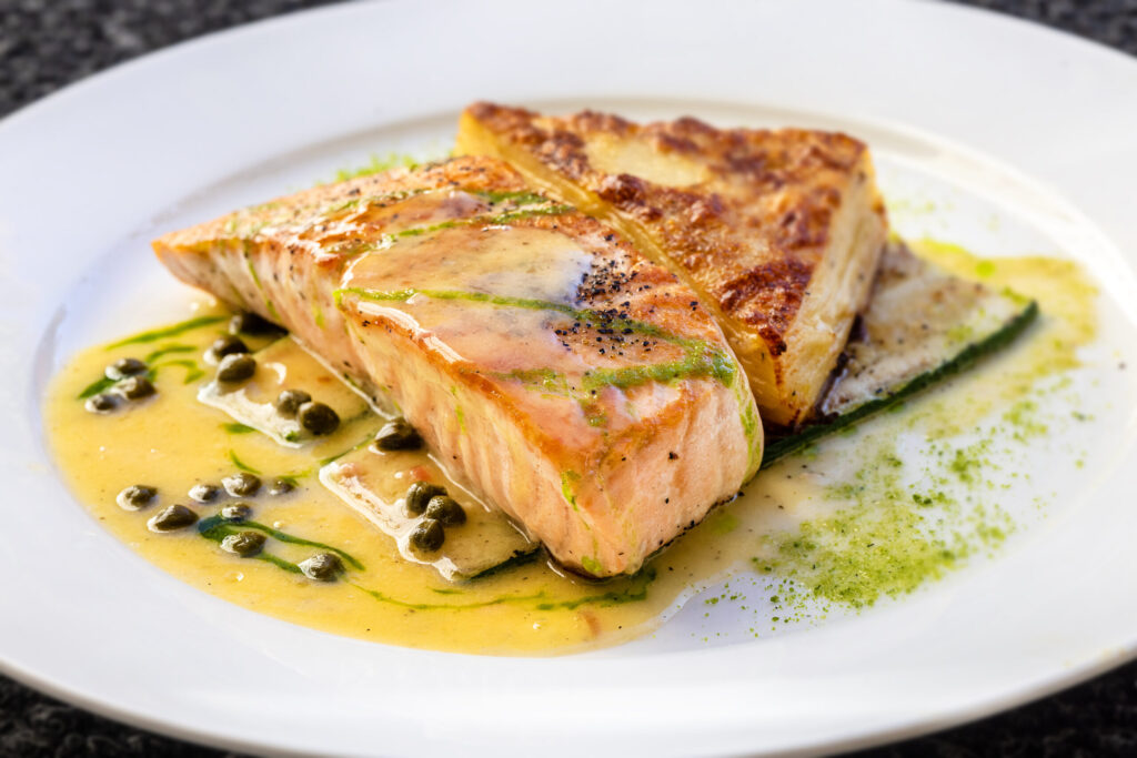Salmone served over grilled zucchini with potato gratin from Ca’Bianca Wednesday, Jan. 28, 2026 on Second Street in Santa Rosa. (John Burgess / The Press Democrat)