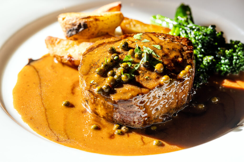 Angus fillet in a brandy peppercorn sauce with roast potatoes and broccoli rabe from Ca’Bianca Wednesday, Jan. 28, 2026 on Second Street in Santa Rosa. (John Burgess / The Press Democrat)