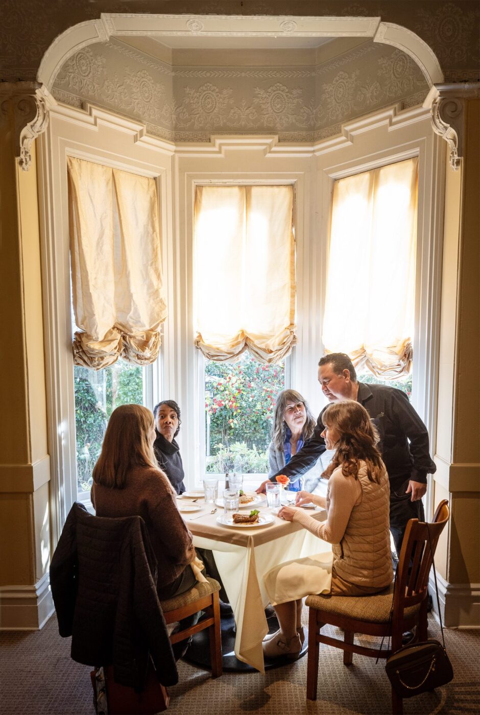 Frank Centano, who has worked for Ca’Bianca since they opened 30 years ago, serves up dessert for friends at lunch Wednesday, Jan. 28, 2026 on Second Street in Santa Rosa. (John Burgess / The Press Democrat)
