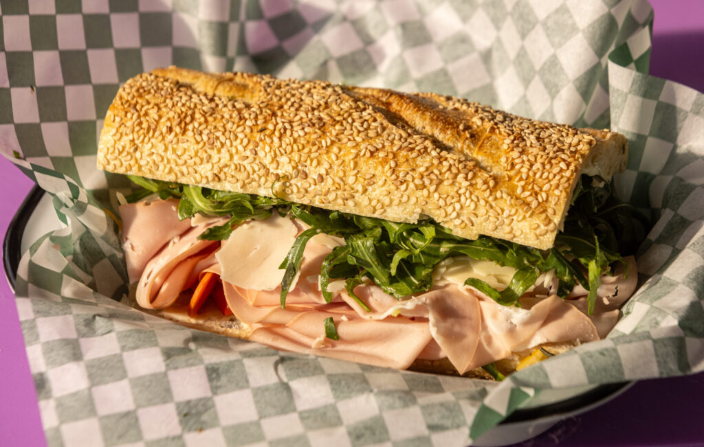 The My Cousin Morty with mortadella, aged provolone, house giardiniera, garlic mayo and arugula on a sesame semolina hero from Genero’s Friday, Jan. 30, 2026 in Sebastopol’s Barlow district. (John Burgess/The Press Democrat)