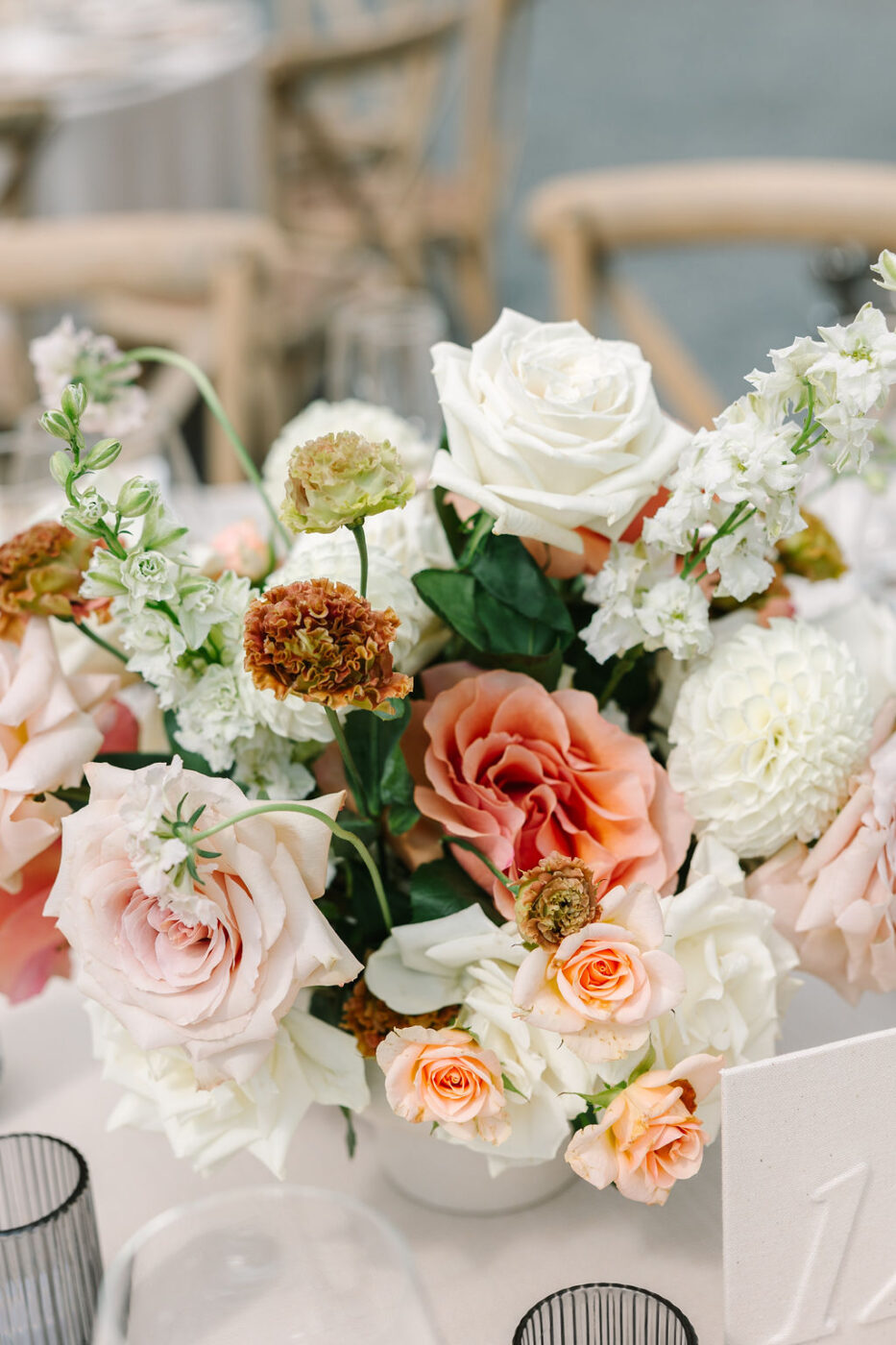 Poppy Stone Floral Design provided the flower arrangements for Kyndall and Blake's late summer wedding ceremony. (Amy Jordan)