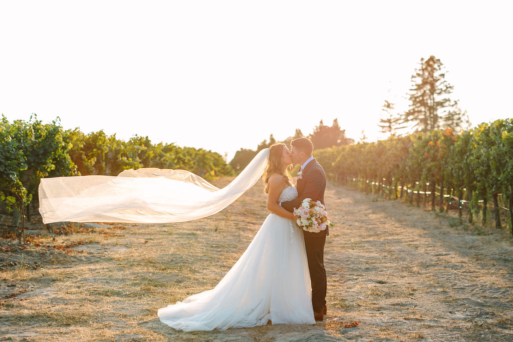Kyndall and Blake wanted a relaxed yet elegant garden vibe as only Wine Country could provide. The couple's late summer ceremony was held at the Dutton Family property with its garden and refurbished barn. (Amy Jordan)