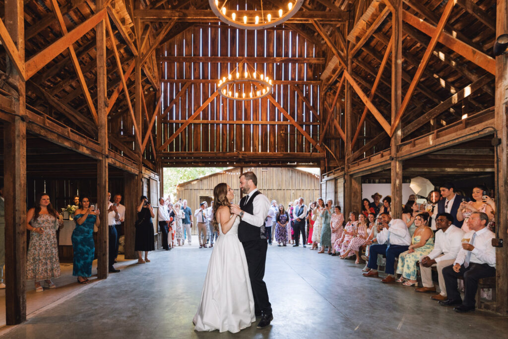 Alexis and Cody have their first dance as a married couple in the farm's rustic barn. (Ashley Carlascio)