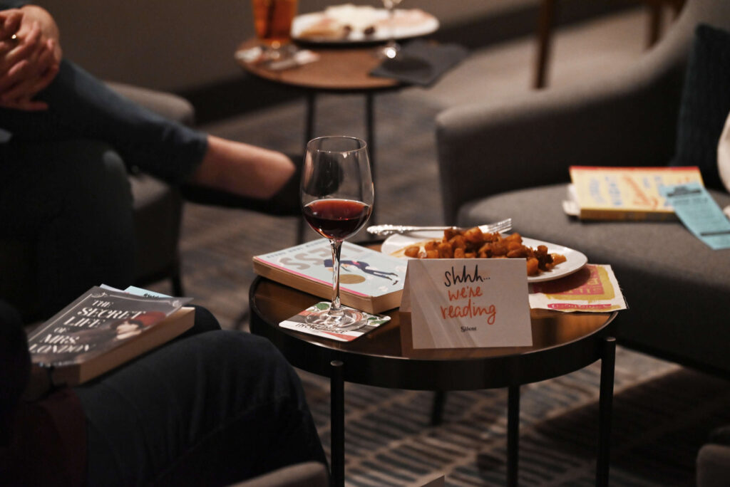 “Shhh…, we’re reading” signs on many of the tables during a meeting of the Silent Book Club held at AC Lounge in Santa Rosa on Wednesday, Dec. 11, 2024. (Erik Castro / For The Press Democrat)